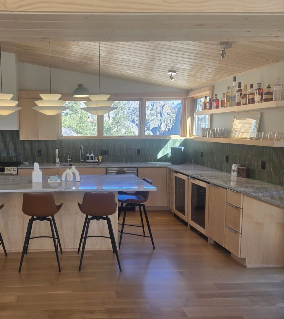 natural maple custom kitchen cabinets with large island in an open plan Colorado home